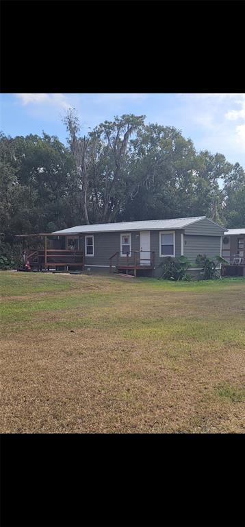 a view of a large pool with lawn chairs