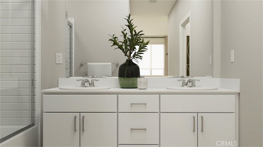 369 Deer Lane Way Perris, CA 92570 - Photo 11 of 15 a bathroom with a sink a mirror and a potted plant