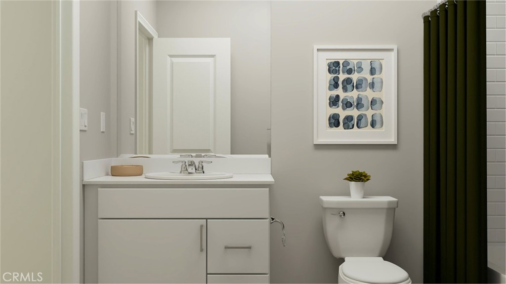 369 Deer Lane Way Perris, CA 92570 - Photo 8 of 15 a bathroom with a toilet sink and mirror