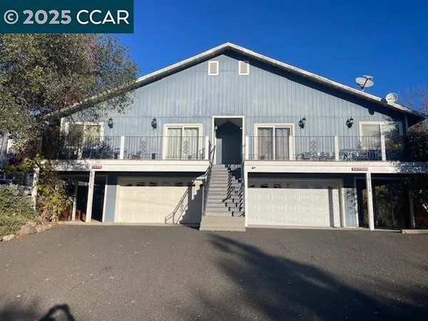 a front view of a house with a garage