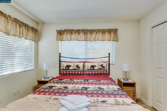 a bed room with furniture and a window