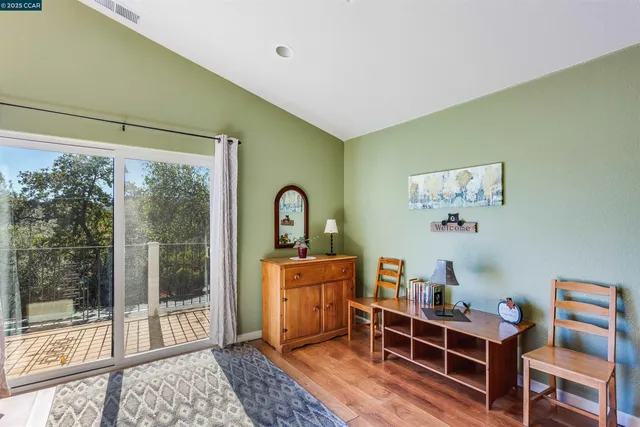 a bedroom with furniture and a window