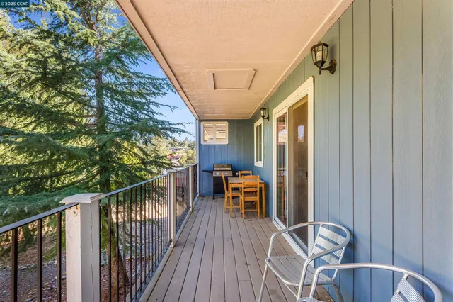 a bedroom with furniture and flat screen tv