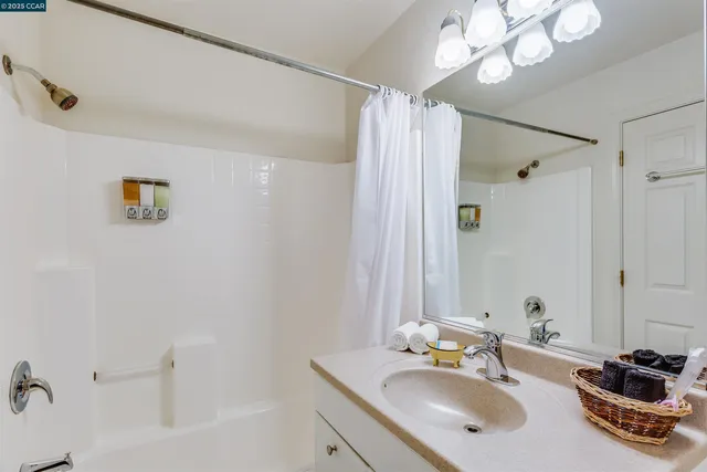 a bathroom with a sink double vanity and a mirror
