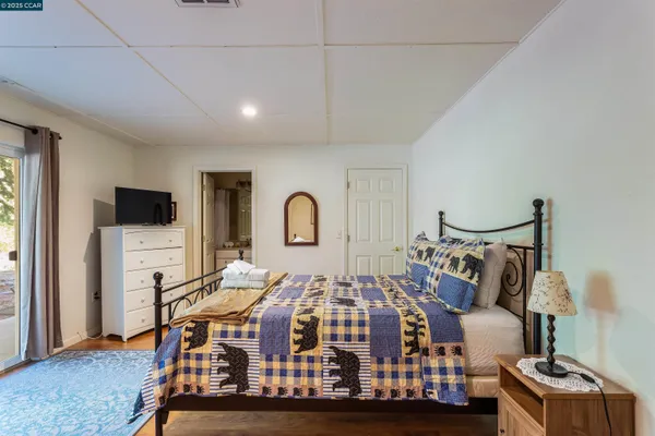 a bed room with a bed and a tv