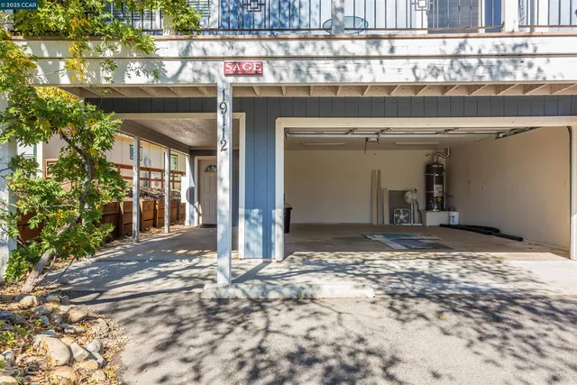 a room with furniture a rug and gym equipment