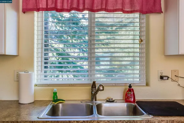 a view of a swimming pool with a table and chairs