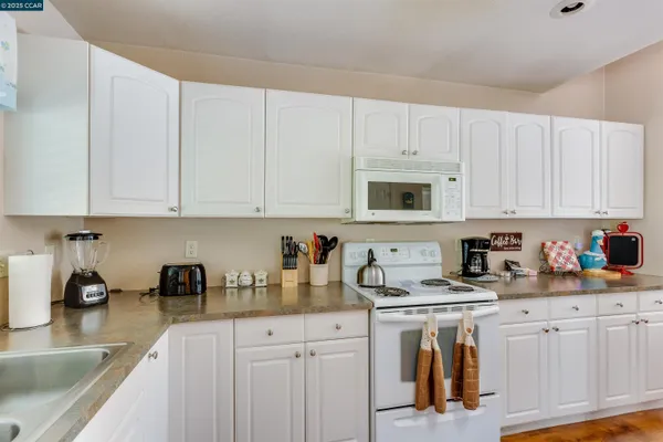 a bedroom with two bed and a window