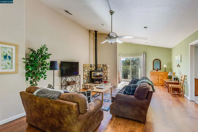 a bedroom with two beds and a dresser