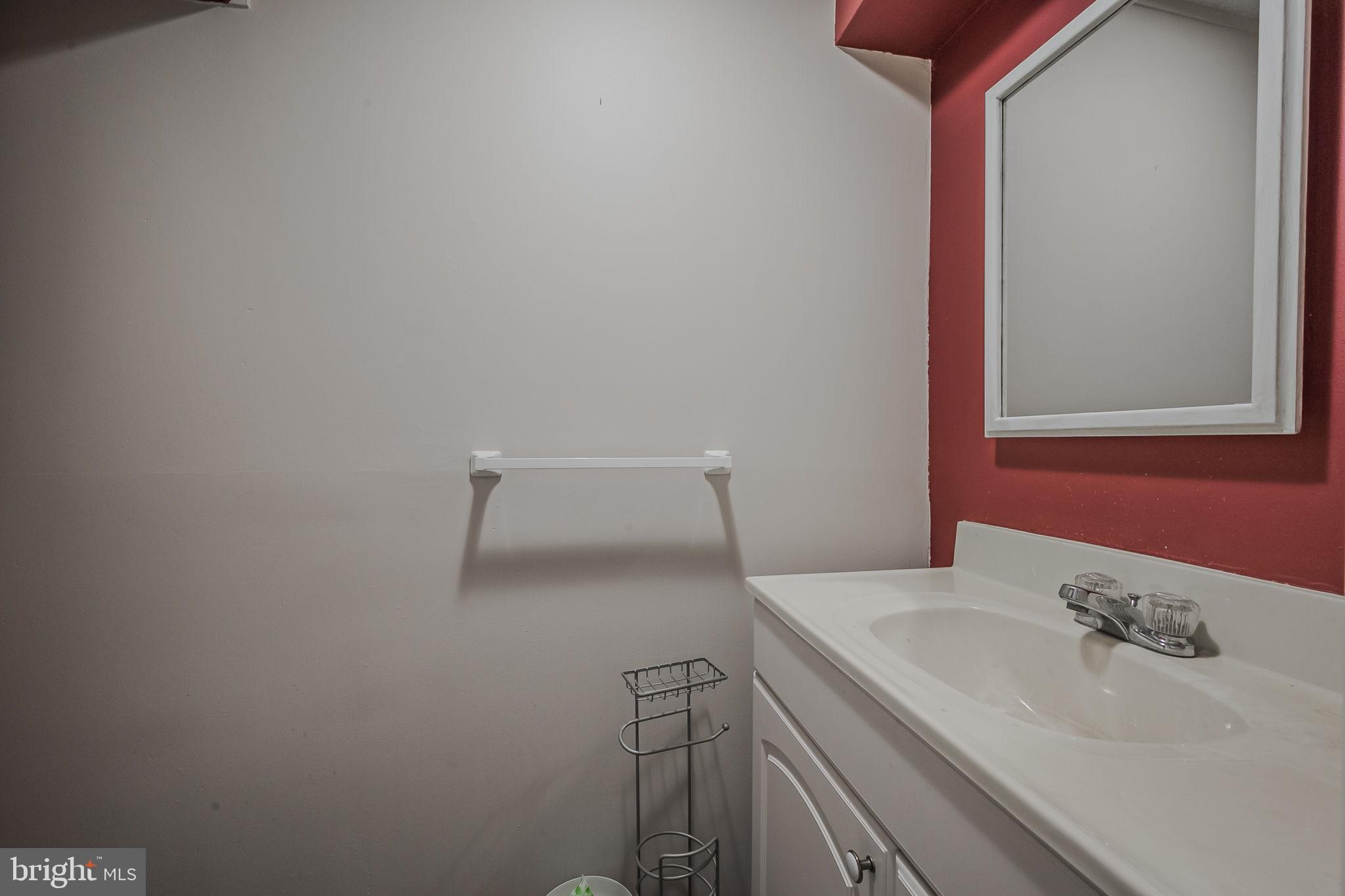 6 Merion Road Newark, DE 19713 - Photo 27 of 36 a bathroom with a sink and a toilet