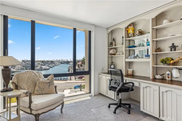a view of a livingroom with workspace and a couch