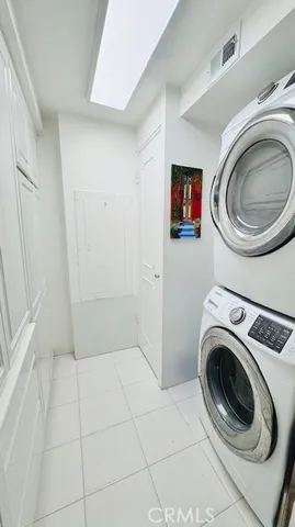 a view of a storage & utility room with washer and dryer