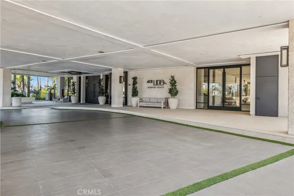 an empty room with entrance and windows