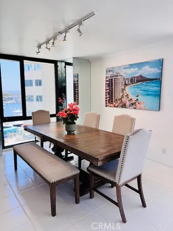 a view of a dining room with furniture and window