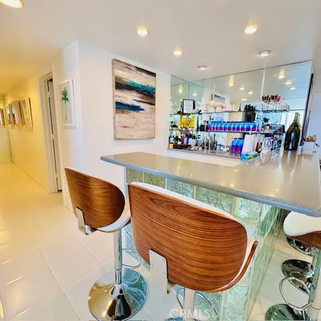 a dining room with furniture and a chandelier