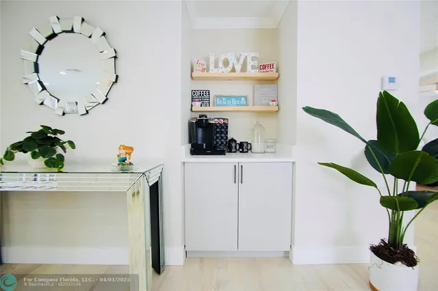 a view of kitchen with cabinets and wooden floor