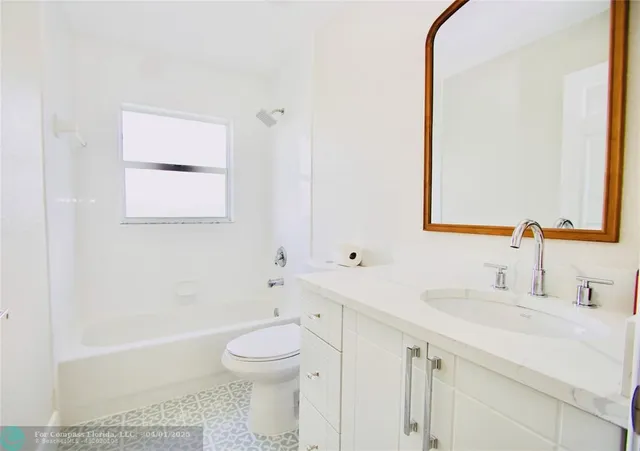 a bathroom with a sink a toilet and a bathtub