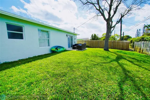 a view of a backyard of the house