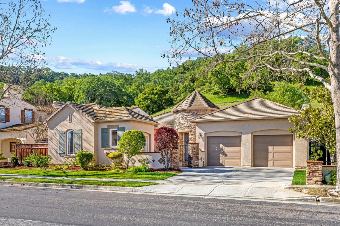 7071 Eagle Ridge Drive Gilroy, CA 95020 - Photo 2 of 72 a front view of a house with a garden and plants