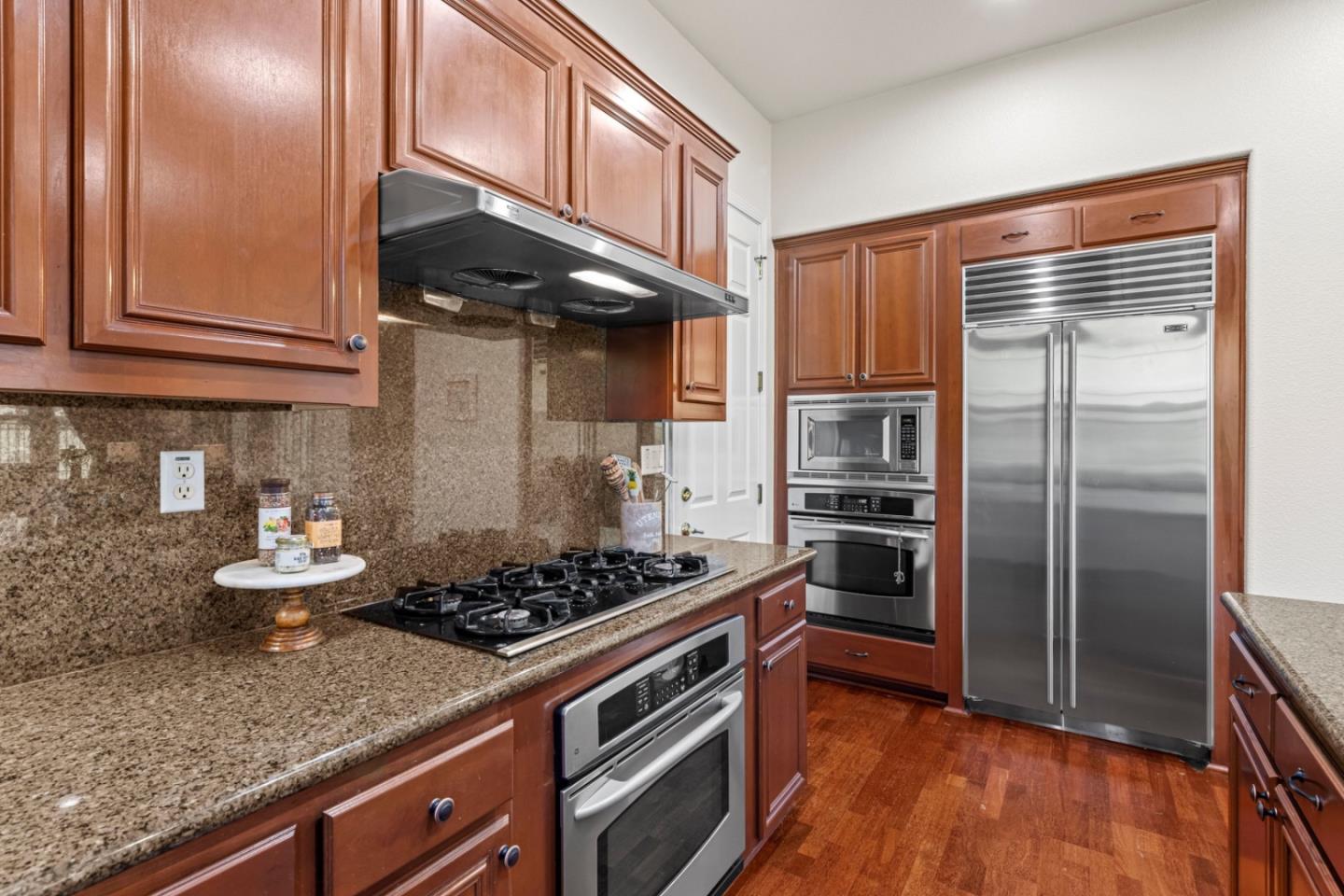 7071 Eagle Ridge Drive Gilroy, CA 95020 - Photo 21 of 72 a kitchen with stainless steel appliances granite countertop a stove and a refrigerator