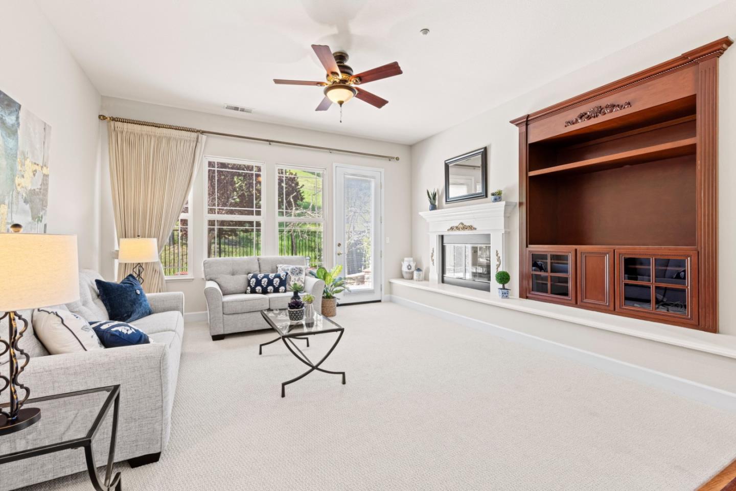 7071 Eagle Ridge Drive Gilroy, CA 95020 - Photo 30 of 72 a living room with furniture a ceiling fan and a window