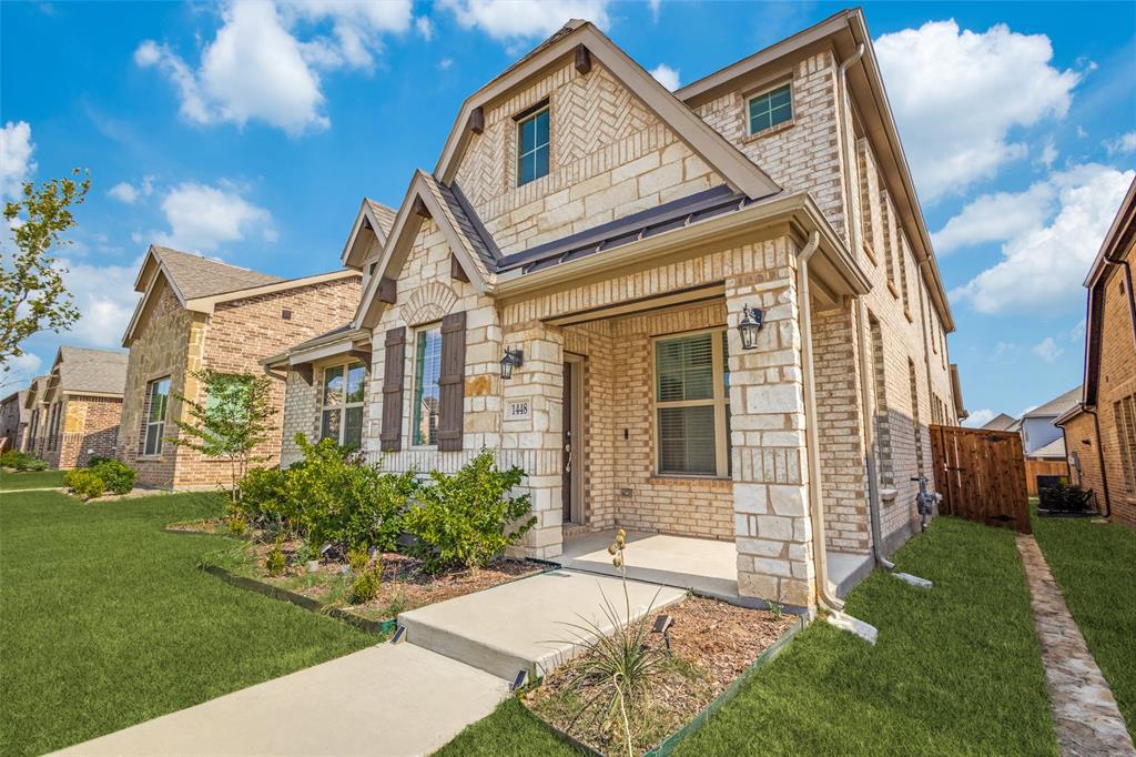1448 Sun Gdn Way Justin, TX 76247 - Photo 2 of 15 Stone and brick facade with gabled roof lines and dark wood shutters