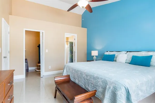 a bedroom with a bed and a couch