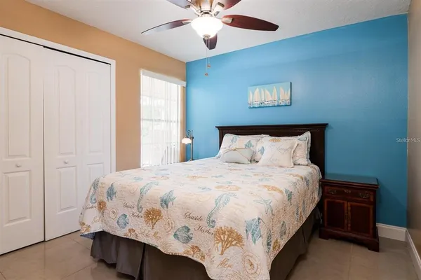 a bedroom with a bed and window