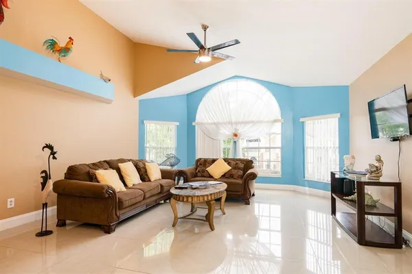 a living room with furniture and a large window