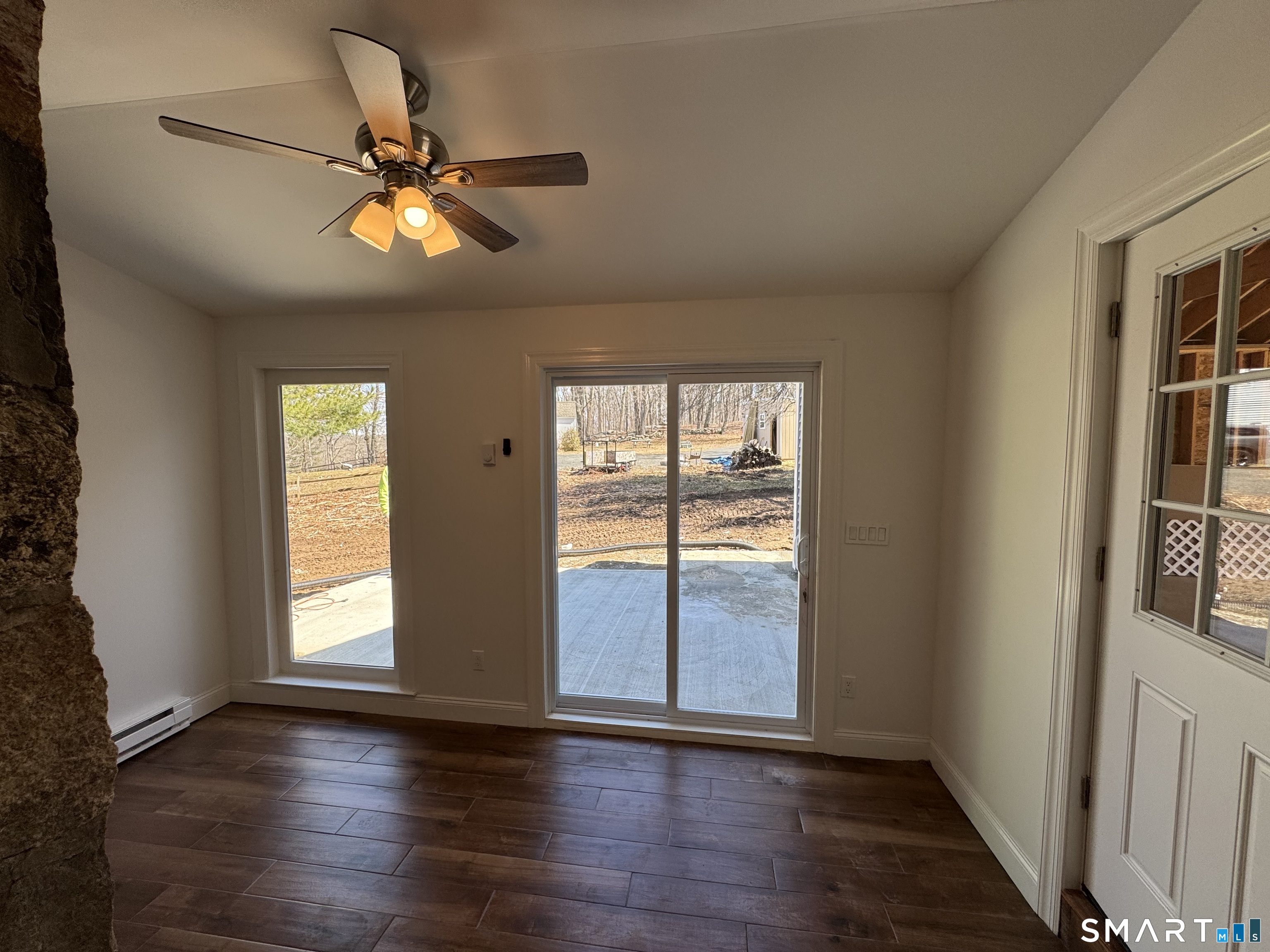 243 Long Hill Road Andover, CT 06232 - Photo 25 of 31 a view of an empty room with wooden floor and a window