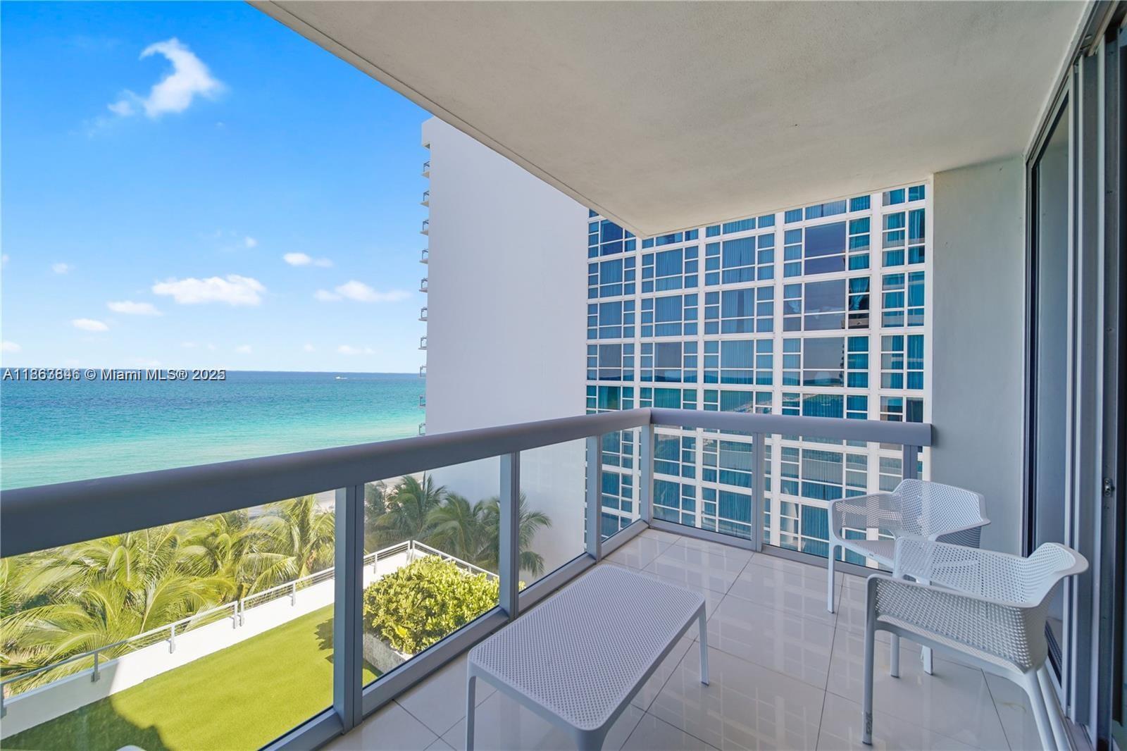 6899 Collins Avenue, Unit 808 Miami Beach, FL 33141 - Photo 2 of 31 a view of balcony with wooden floor and seating space