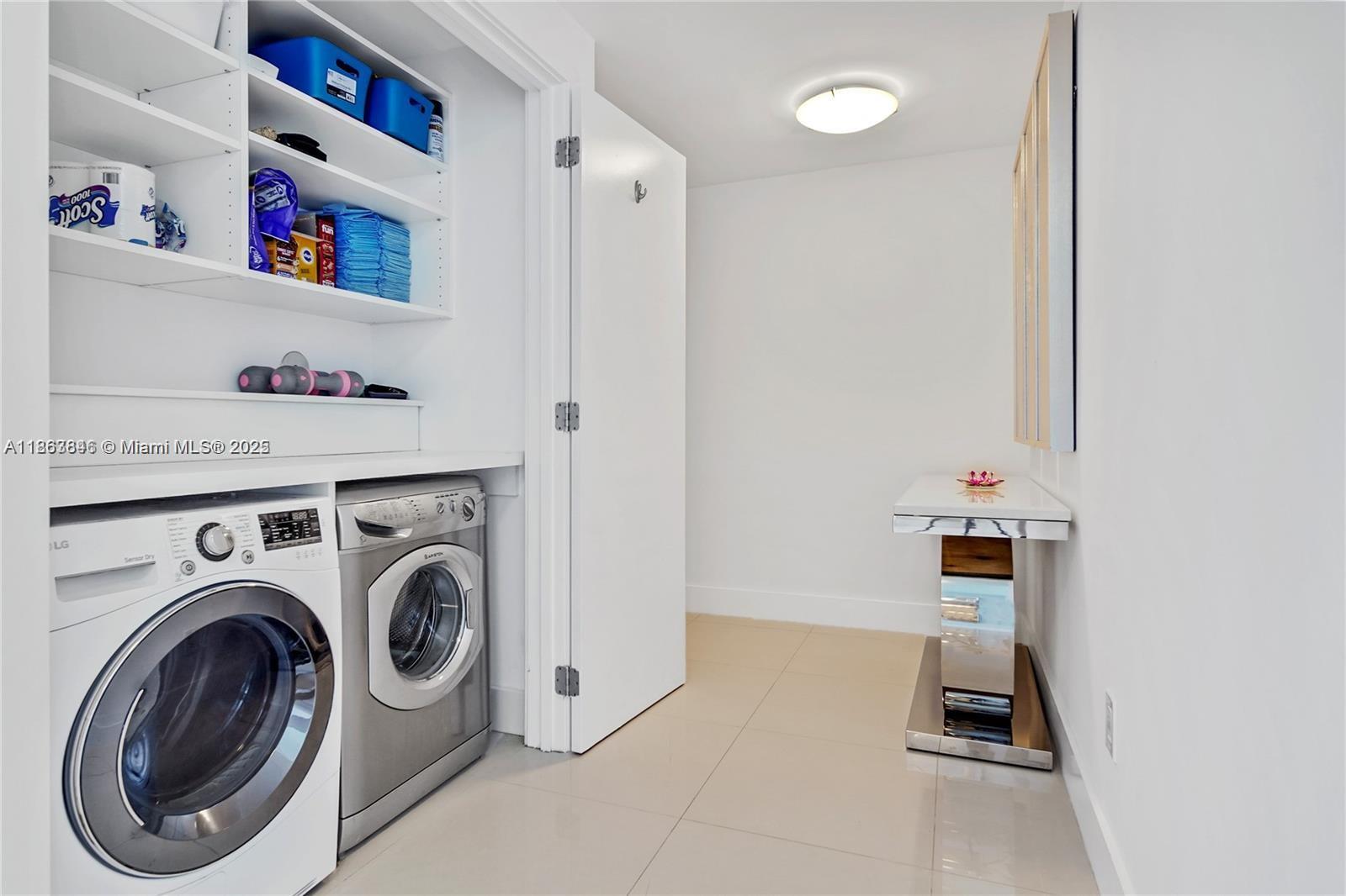6899 Collins Avenue, Unit 808 Miami Beach, FL 33141 - Photo 31 of 31 a utility room with dryer and washer