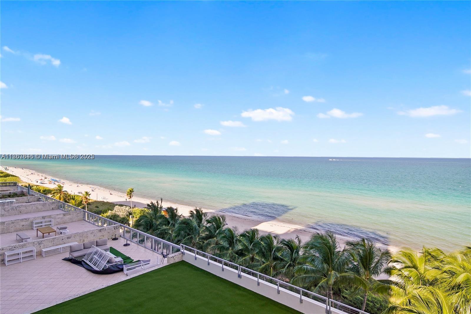 6899 Collins Avenue, Unit 808 Miami Beach, FL 33141 - Photo 4 of 31 a view of a lake with a yard