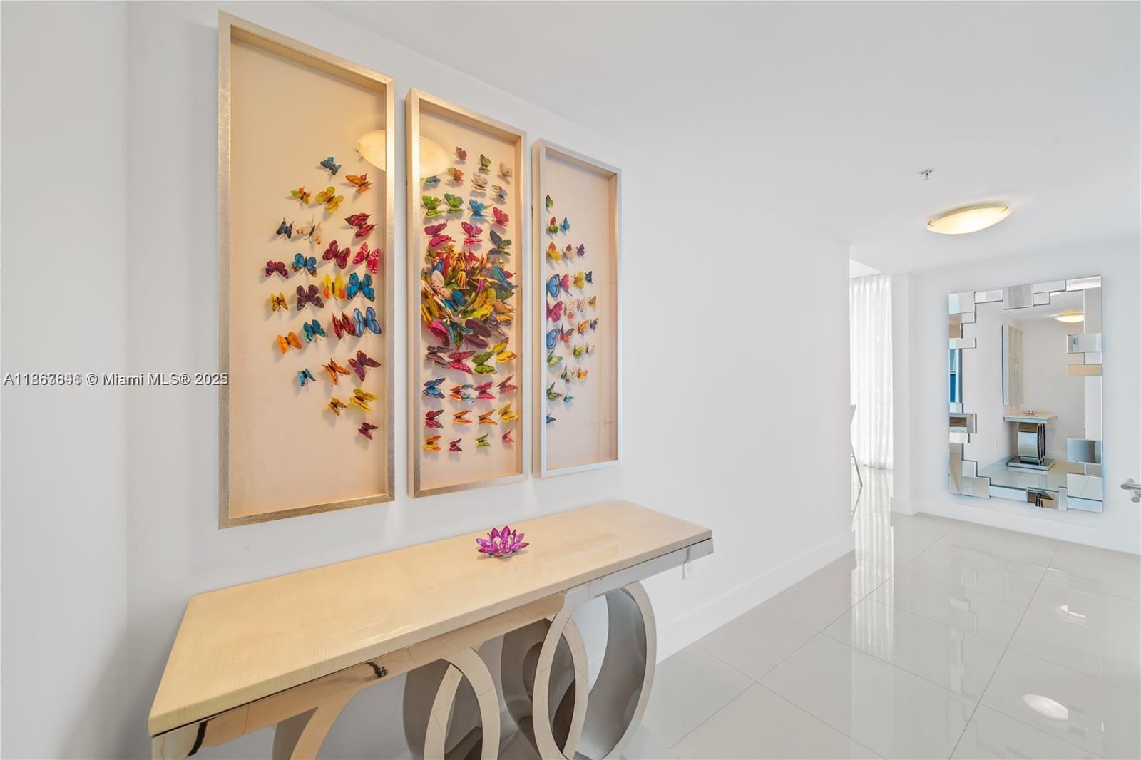 6899 Collins Avenue, Unit 808 Miami Beach, FL 33141 - Photo 7 of 31 a bathroom with a sink and a mirror