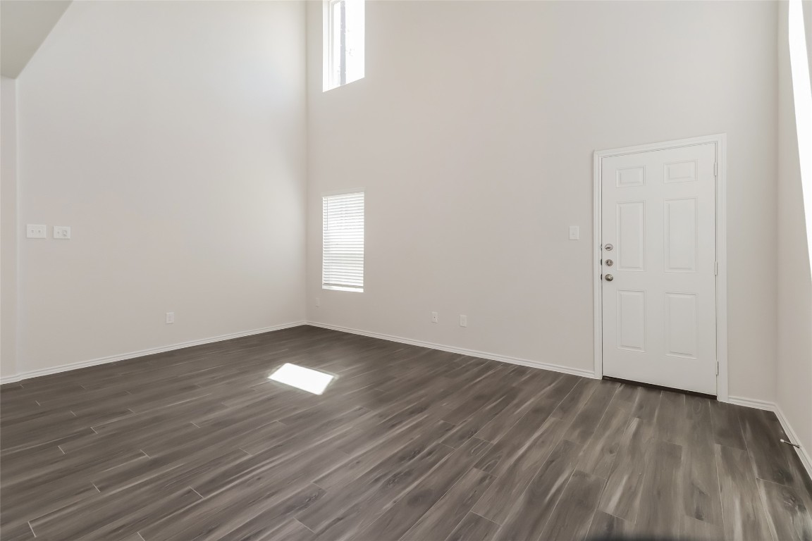 15200 Estrella Road East Houston, TX 77073 - Photo 3 of 13 a view of empty room with wooden floor and fan