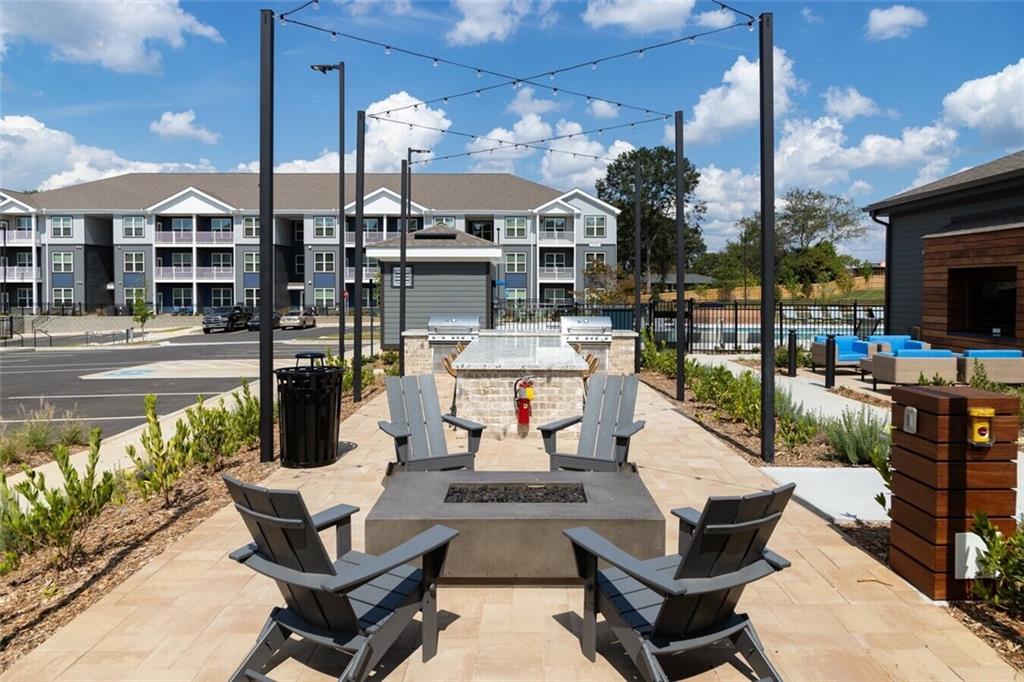 191 Commerce Drive, Unit B1 Villa Rica, GA 30180 - Photo 16 of 30 a view of a patio with couches table and chairs