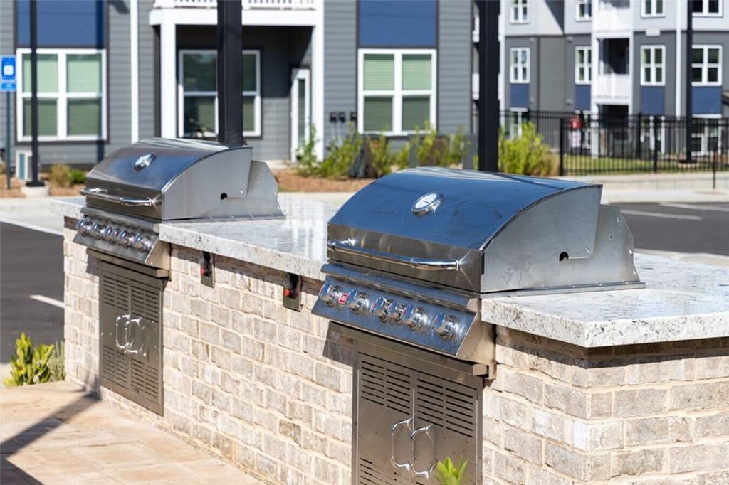 191 Commerce Drive, Unit B1 Villa Rica, GA 30180 - Photo 19 of 30 a view of a brick building with a outdoor space