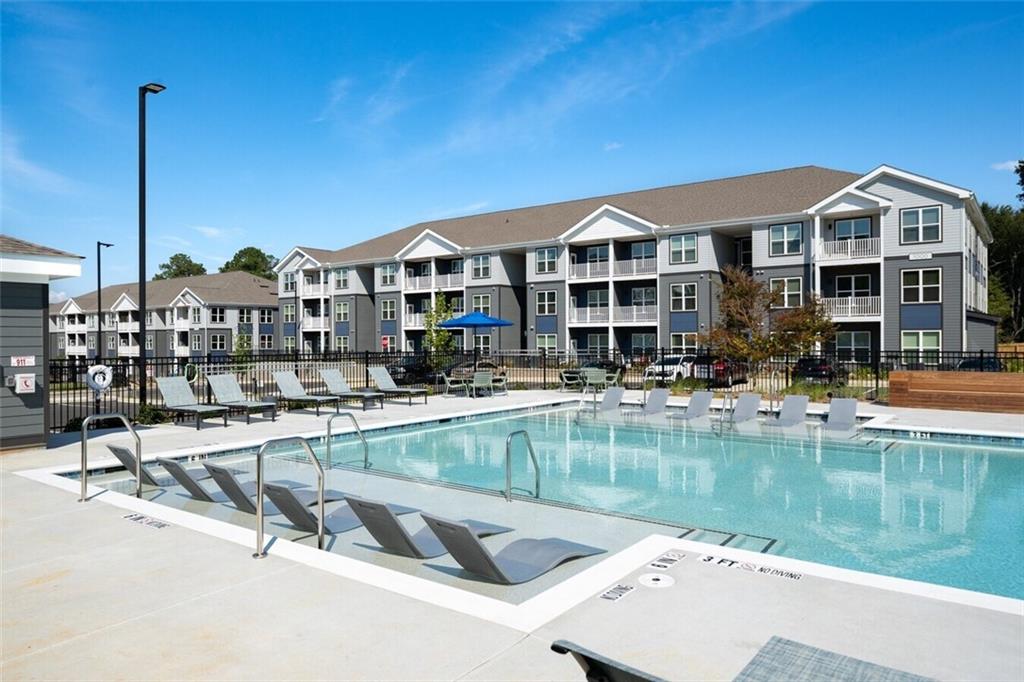 191 Commerce Drive, Unit B1 Villa Rica, GA 30180 - Photo 21 of 30 a view of a lake with a house