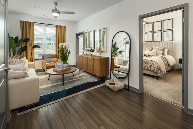 a bed room with a bed and a large window