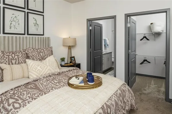 a bed room with a bed and a mirror