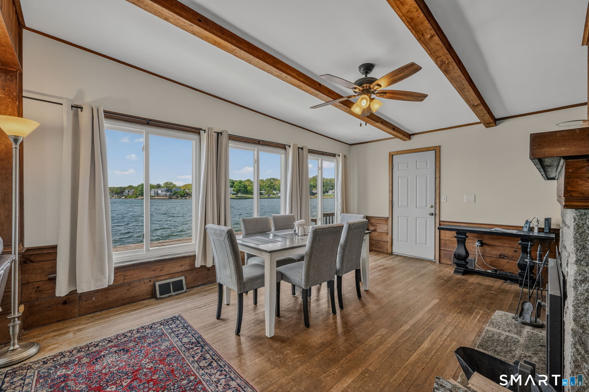 210 Shore Road Waterford, CT 06385 - Photo 17 of 26 a dining room with furniture window and wooden floor