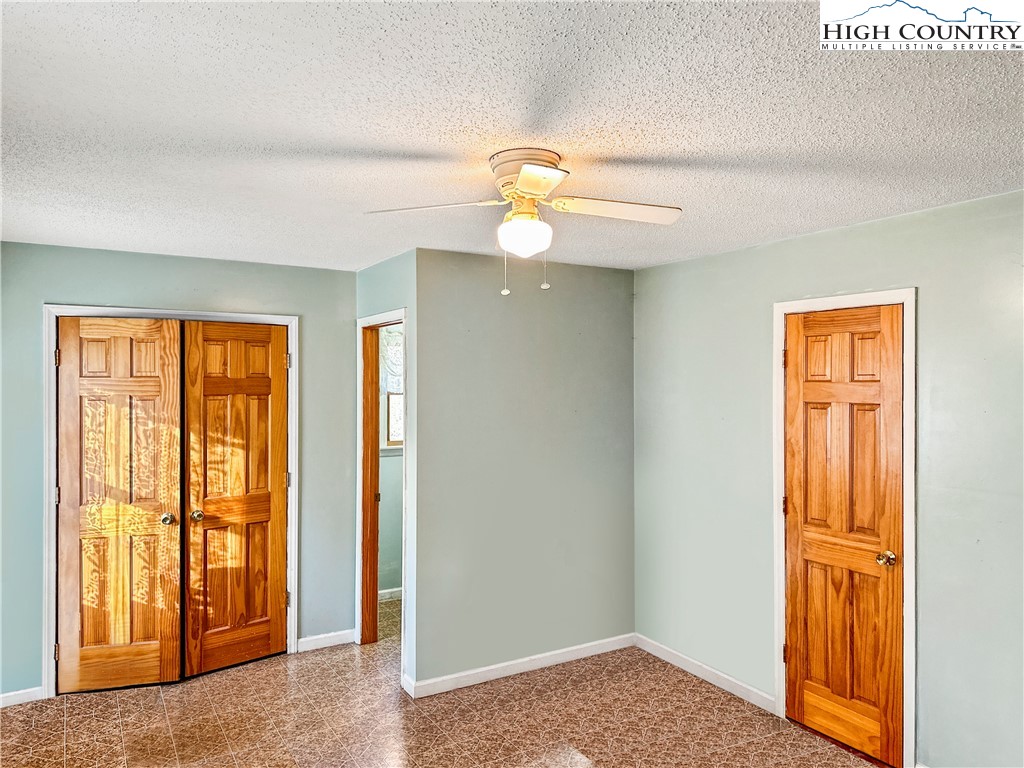 2496 Tucker Road Lansing, NC 28643 - Photo 16 of 20 a view of entryway with wooden floor