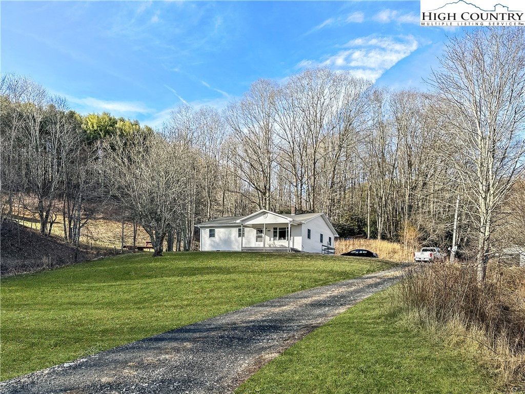2496 Tucker Road Lansing, NC 28643 - Photo 4 of 20 a view of a house with a yard