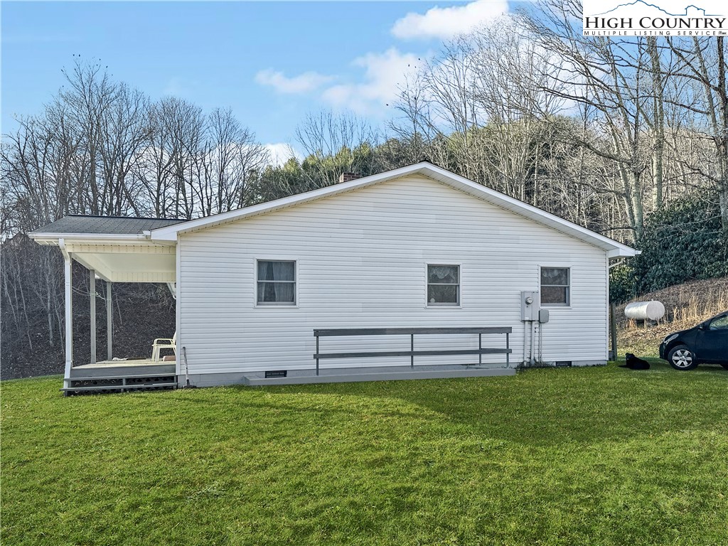 2496 Tucker Road Lansing, NC 28643 - Photo 5 of 20 a view of a house with a yard