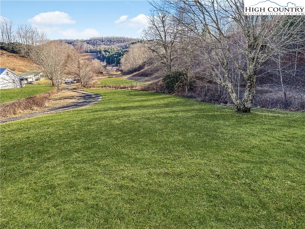 2496 Tucker Road Lansing, NC 28643 - Photo 6 of 20 a view of a field with an trees