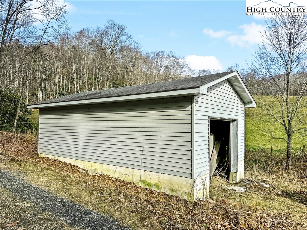 2496 Tucker Road Lansing, NC 28643 - Photo 8 of 20 a view of a house with a yard