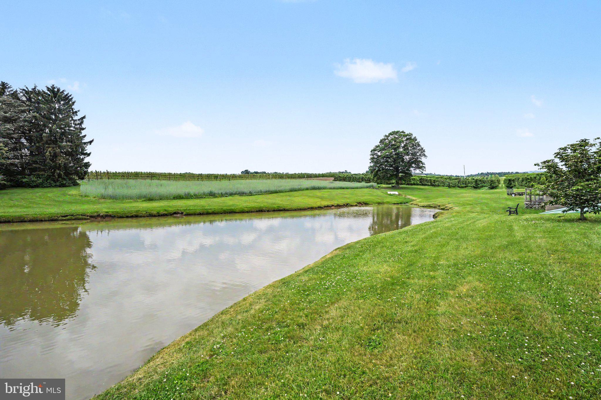 420 Carlisle Road Biglerville, PA 17307 - Photo 31 of 41 a view of a lake with a houses in the background