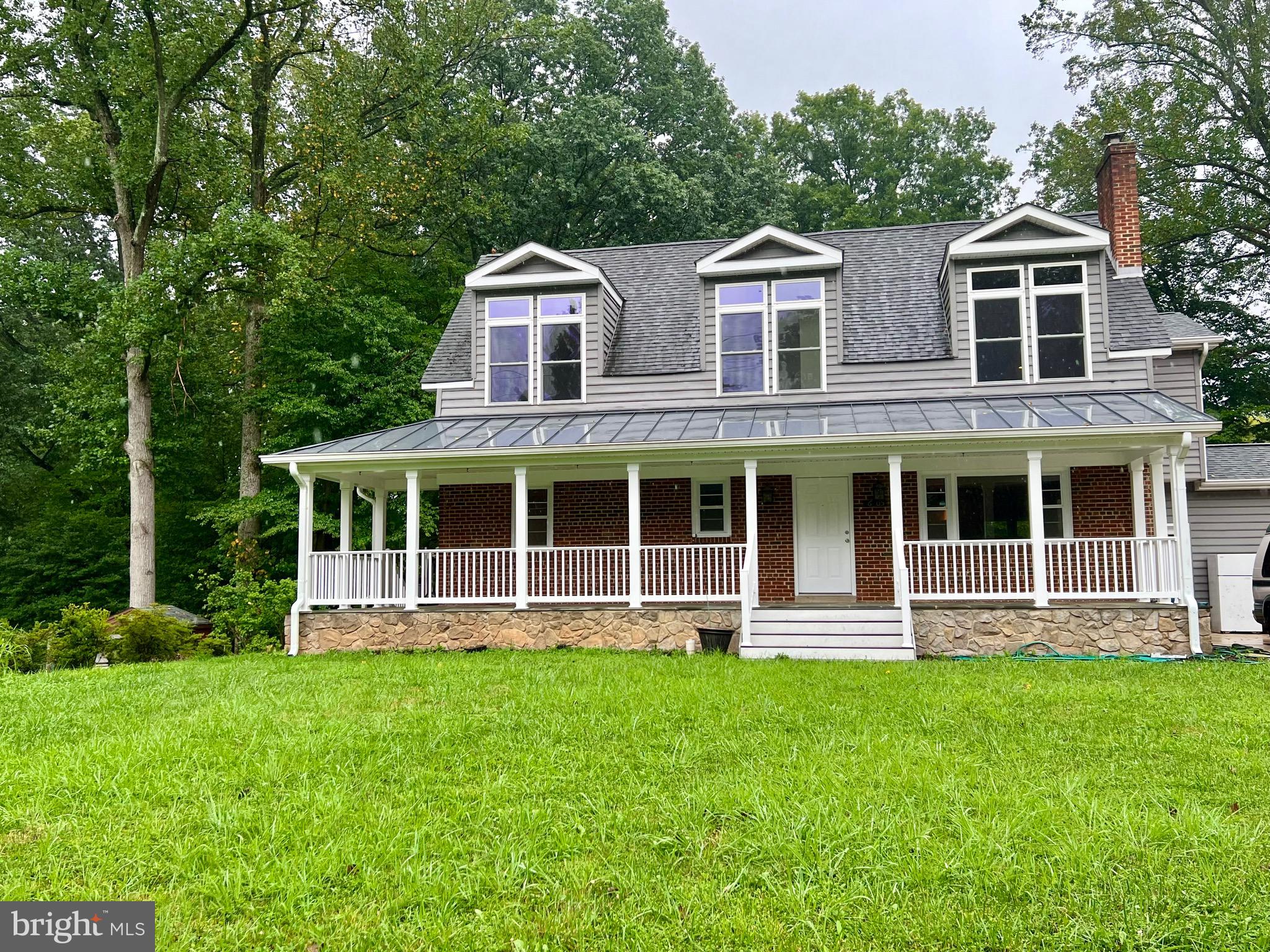 6605 Keene Drive Springfield, VA 22152 - Photo 24 of 127 a front view of a house with a yard