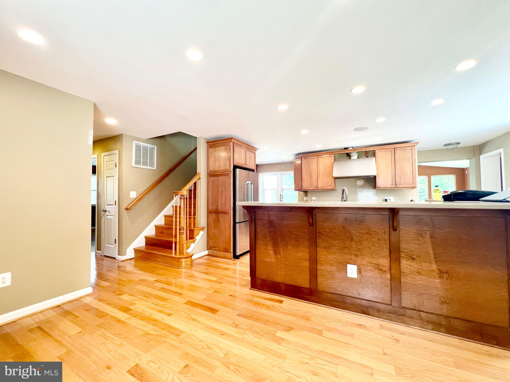 6605 Keene Drive Springfield, VA 22152 - Photo 35 of 127 a view of a kitchen with wooden floor and stairs