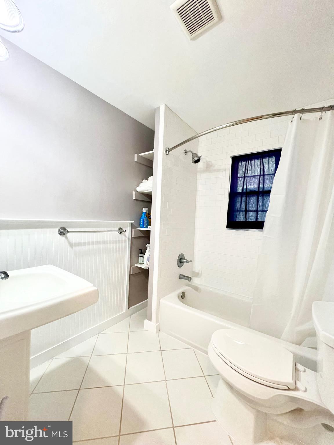 6605 Keene Drive Springfield, VA 22152 - Photo 48 of 127 a bathroom with a toilet a sink and bathtub